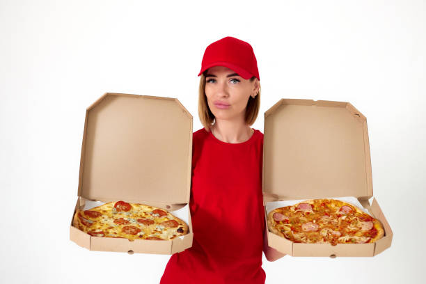 istock pizza delivery girl showing pizza inside boxes 1411337130