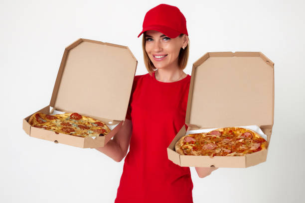 istock pizza delivery girl showing pizza inside boxes 1411338798