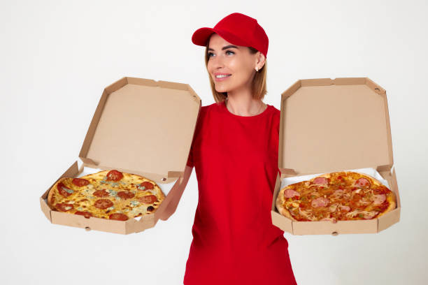 istock pizza delivery girl showing pizza inside boxes 1411338803