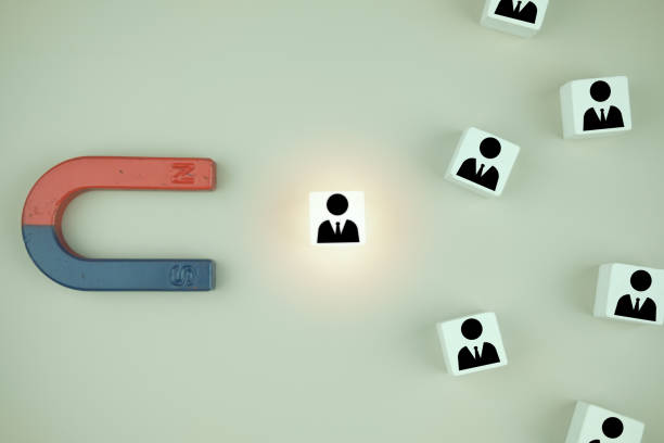istock Wooden cube with human icons with attracting professionals to orginaization. 1411342178