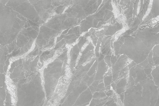 Grey marble seamless glitter texture background, counter top view of tile stone floor in natural pattern.