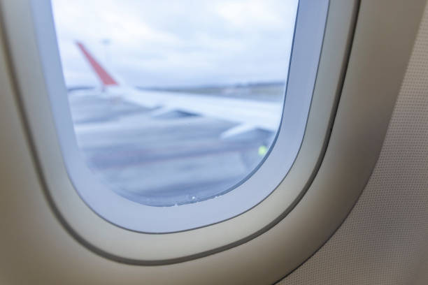 istock View of the airplane wing seen through the window. 1411346644