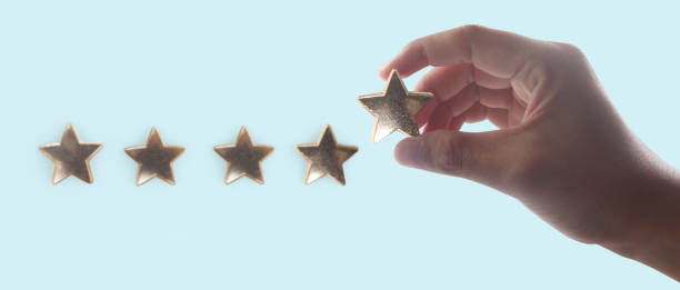 istock Rise on increasing five stars in human hand 1411346854