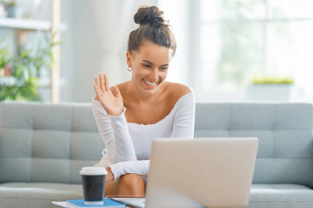 istock woman working on laptop at home 1411350063