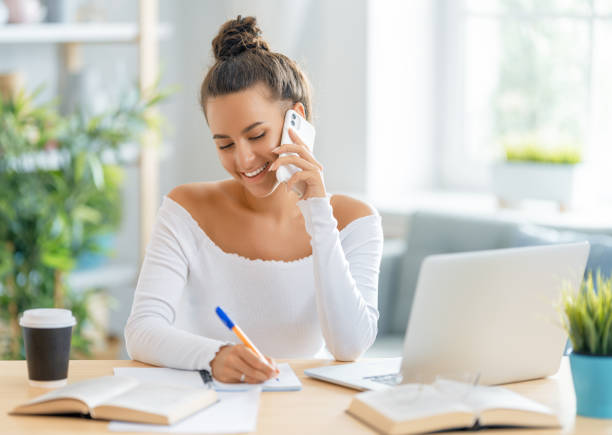 istock woman working on laptop at home 1411350090