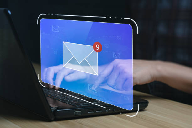 istock email marketing concept. Businessman using tablet surfing internet on desk with email icon, electronic mail, e-commerce. newsletter email and protect your personal information from spam mail concept 1411350220