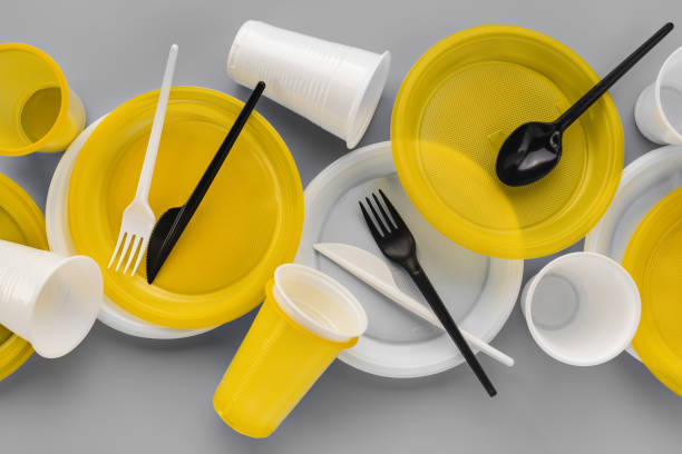 istock A set of a variety of disposable plastic tableware utensils. 1411354087