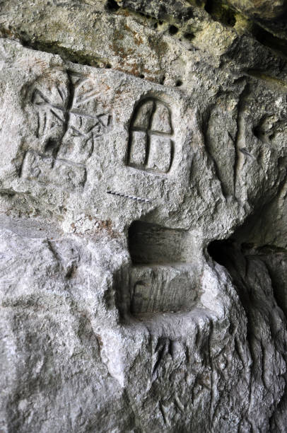 istock Ancient Germanic runes on the wall of the cave 1411354738