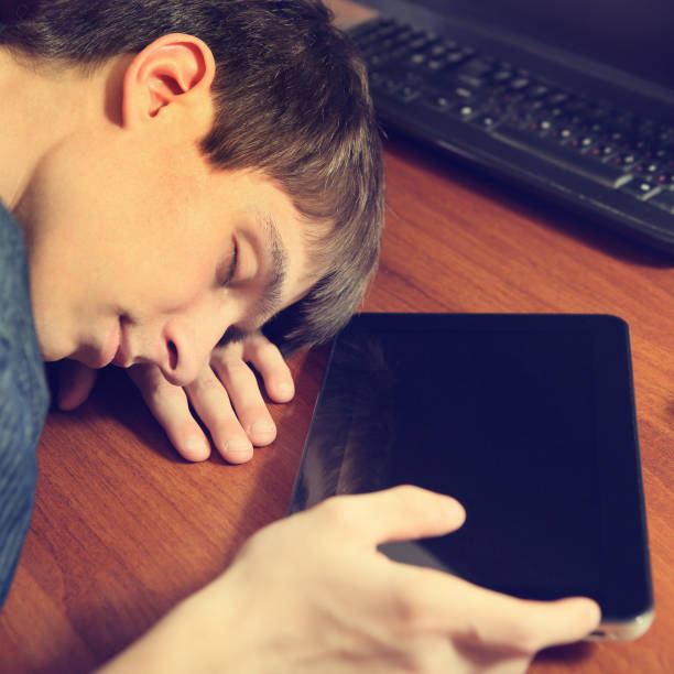 istock Teenager sleep with Tablet 1411354741
