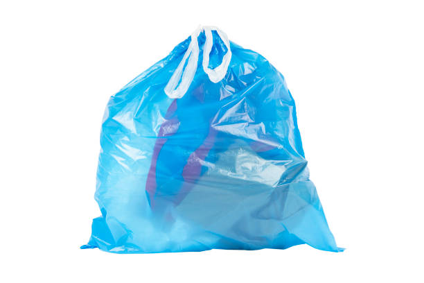 istock Blue trash bag filled with garbage isolated on white background. Garbage bag isolated. Blue trash bag filled with garbage isolated 1411355464