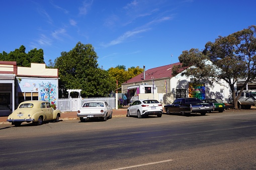 Coolgardie, Western Australia, Australia, June 26, 2022. \nClassic car club members having a coffee break in a roadside cafe
