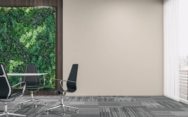 istock Empty office interior with a conference table and chairs in front of the vertical garden, partly hardwood background, partly beigeplaster wall, and large windows 1411362095