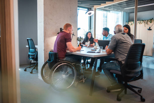 istock Employee Engagement Between Interns and Male Manager with Disabilities 1411362516