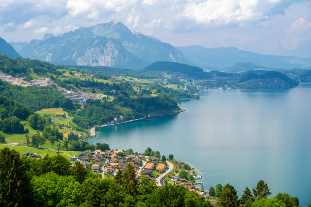 blick auf den thunersee und die alpen in der schweiz - switzerland green thun aerial view stock-fotos und bilder