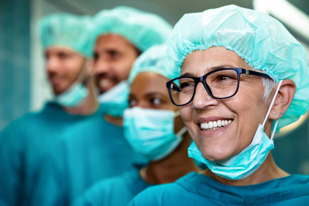 istock Successful team of surgeon standing in operating room, ready to work on a patient 1411366638