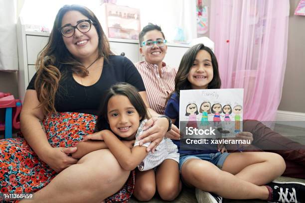 Portrait Of Lesbian Parented Family And Childs Drawing Stock Photo - Download Image Now