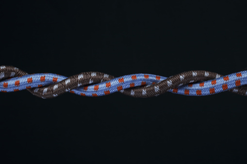 Two ropes are together on black background