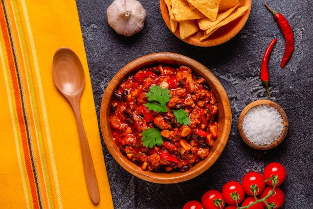 istock Chili Con Carne in bowl on dark background. 1411373288