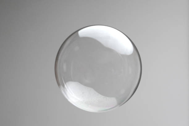 istock Flying soap bubbles on grey background. Abstract soap bubbles with reflections. Soap bubbles in motion background. 1411376069