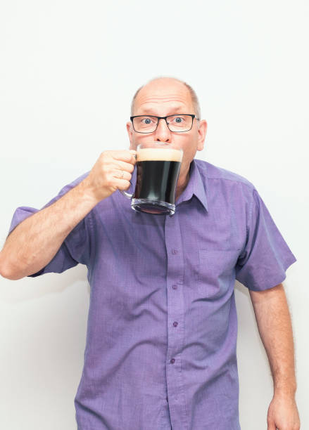 istock A 50-year-old Caucasian man drinks dark beer with pleasure. 1411376127