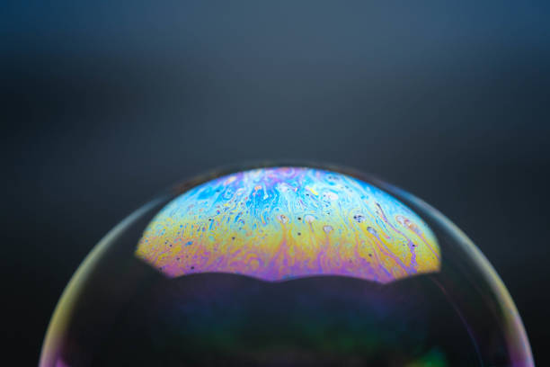 istock Beautiful soap bubbles animation graphics on black background. Abstract soap bubbles with colorful reflections. Soap bubbles in motion background. 1411376154