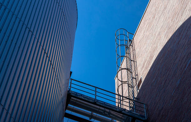 istock Low Angle View Of Fire Escape Against Clear Blue Sky 1411377518