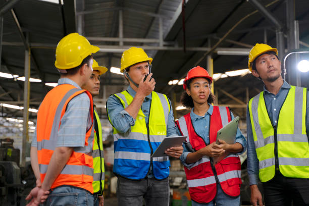 istock Blue collar worker works with machine at factory. 1411377653