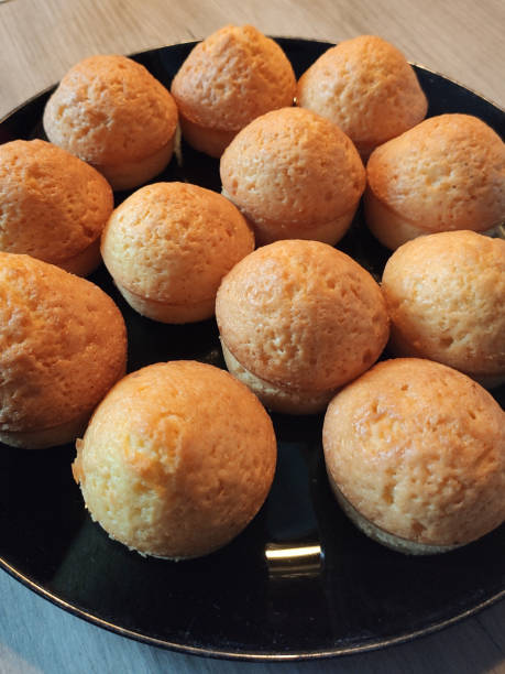 istock delicious puffy cupcakes on a plate on the table 1411379088