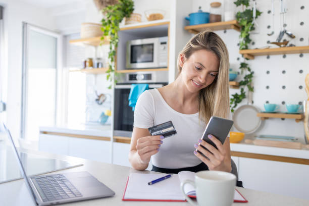 istock Woman shopping online and smiling 1411379862
