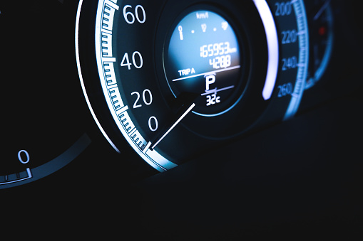 Speedometer kilometer per hour on dashboard of the automobile