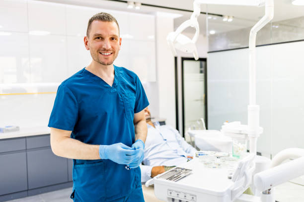 Dentist with anesthesia in hands, getting ready to see patient Dentist with anesthesia in hands, getting ready to see patient dental drill stock pictures, royalty-free photos & images
