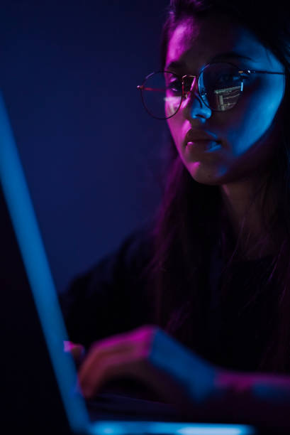 istock Attractive young woman working in home at night. 1411381056