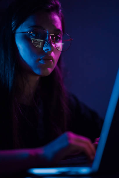 istock Attractive young woman working in home at night. 1411381064