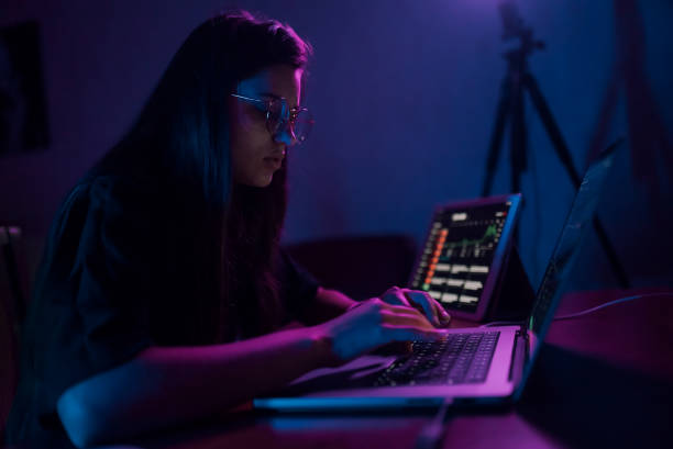 istock Attractive young woman working in home at night. 1411381119
