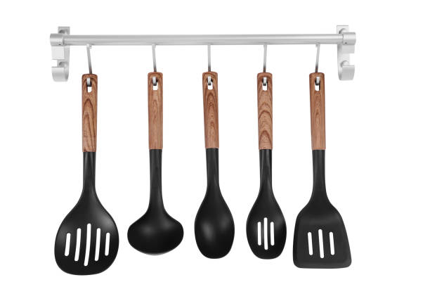 istock Metal rack with set of kitchen utensils on white background 1411382215