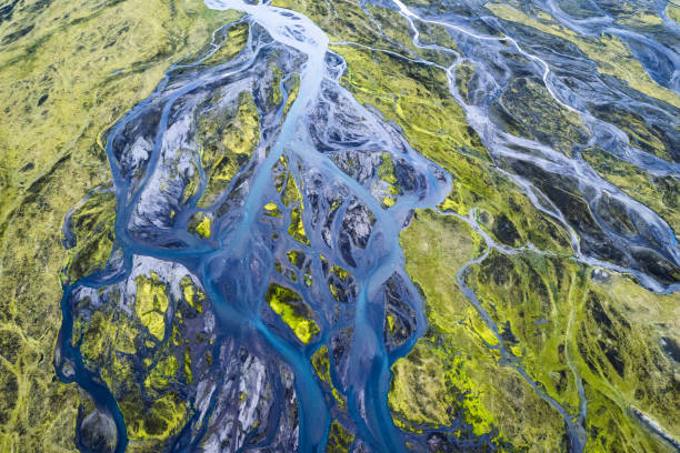 istock Abstract blue glacier rivers pattern flowing through volcanic moss field in Icelandic highlands on summer 1411382401
