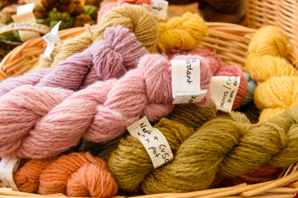 istock Sheep wool dyed using natural dyes such as nettles and berries in a basket. 1411383629