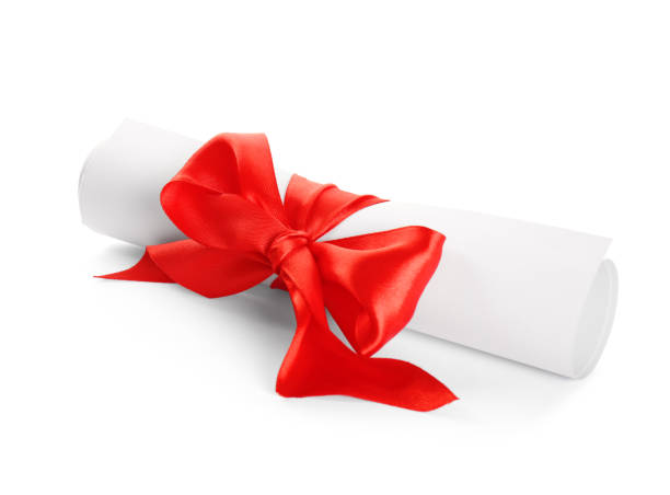 istock Rolled student's diploma with red ribbon on white background 1411384929