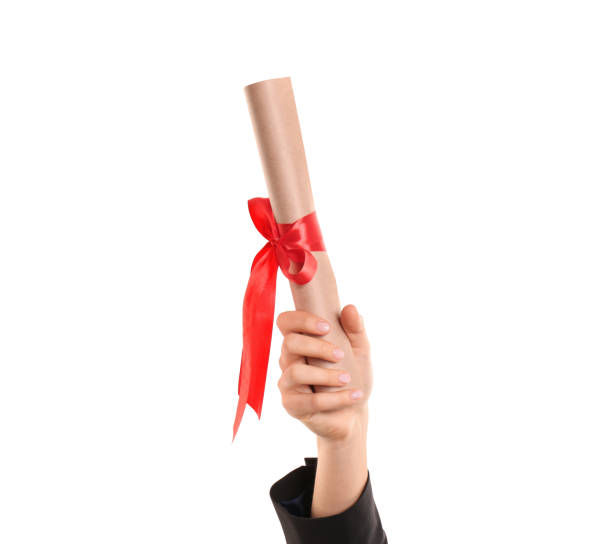 istock Student holding rolled diploma with red ribbon on white background, closeup 1411385058
