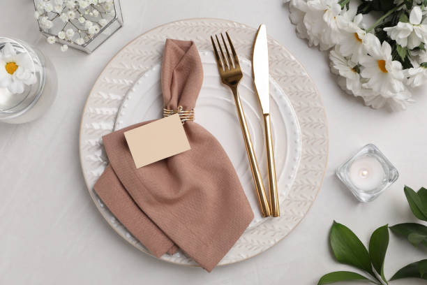 istock Elegant festive setting with floral decor on white table, flat lay 1411385266