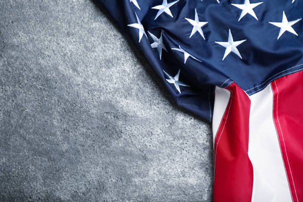 istock National flag of America on grey table, top view. Space for text 1411386487