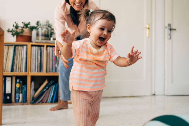 istock Girl Running From Her Mother While Playing 1411388053