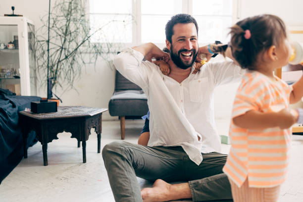 istock Father Playing With His Two Children 1411388074