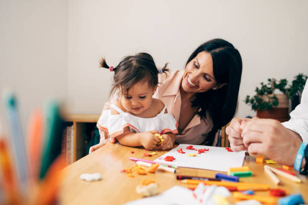 istock Mother And Daughter Playing With Playdough 1411388091