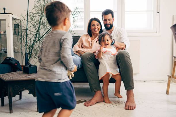 istock Family Posing For A Photograph 1411388128