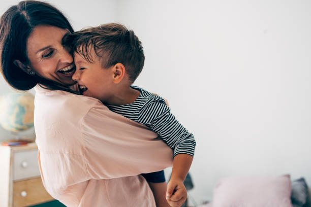 istock Mother Holding Her Son 1411388148