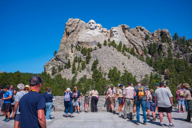 Mount Rushmore National Memorial, Black Hills Region of South Dakota photographed with clear skies Keystone, SD, USA - Jun 22, 2022: Tourists view Mount Rushmore National Memorial depicts the faces of U.S. presidents George Washington, Thomas Jefferson, Theodore Roosevelt and Abraham Lincoln. theodore roosevelt us president stock pictures, royalty-free photos & images