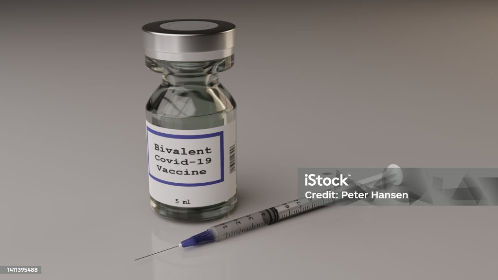 Bivalent Covid-19 vaccine vial and syringe Single bivalent covid-19 vaccine vial and syringe Vaccination Stock Photo