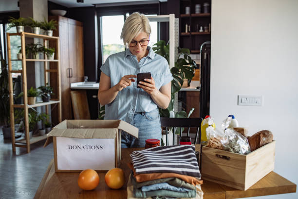 istock Woman packing charity box 1411396674