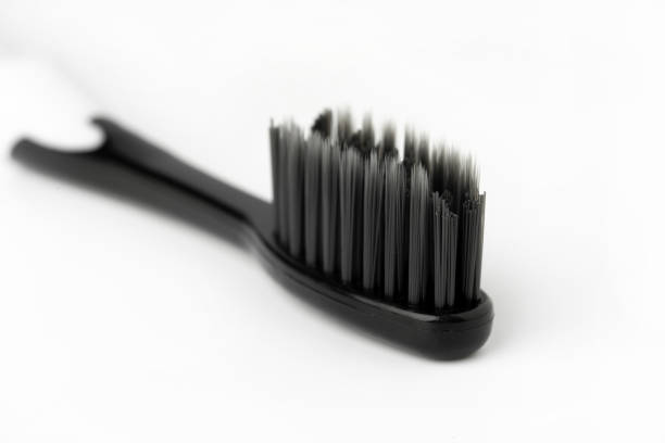 istock Black Toothbrush isolate on white background, close up shot 1411397896